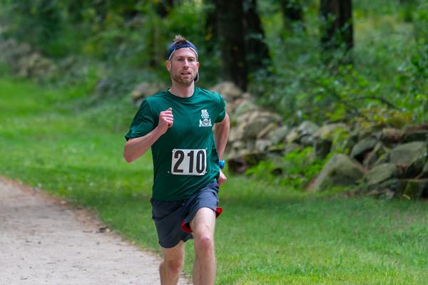 In September, Brian Schneider, overall winner for the 5K Run for STEM, heads toward the finish line with a time of 19:05. 