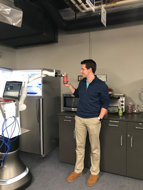 In November, Keller has fun with one of the many robots available to startups in the shared workspace innovation laboratory at MassRobotics.