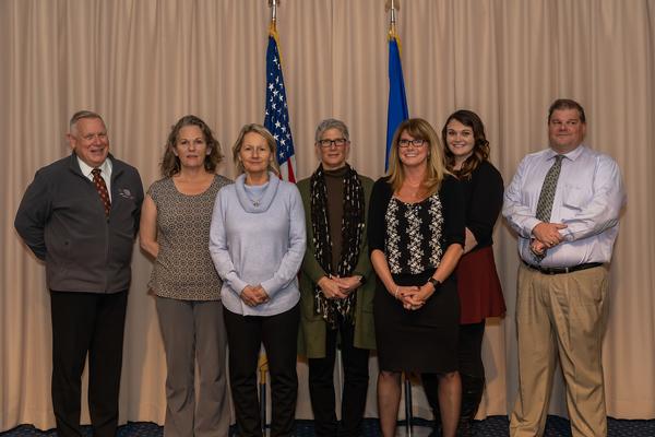 During the holiday social in December, Patrick Marr, chairman of the board far l), congratulates the chapter's 2019 "Unsung Heroes" (l-r) April Mills, NC3 Integration Directorate; Kathleen O'Connor, Digital Directorate; Carolyn, McCafferty, 66th Air Base Group; and the Chapter recipients, Michele Cimino, Booz Allen Hamilton; Heather Collins, Enterprise IT and Cyber Infrastructure Division; and Kevin MacDonald, Air Force Life Cycle Management Center (AFLCMC)/Hanscom Air Force Base, Operational Contracting. Unable to attend and not pictured Brad Gosselin was a recipient from the combined AFLCMC/OL/SO Staff and Detachment 7. 