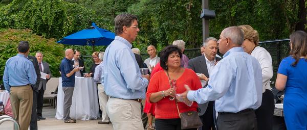 Members enjoy mingling at this year's summer social in August.  