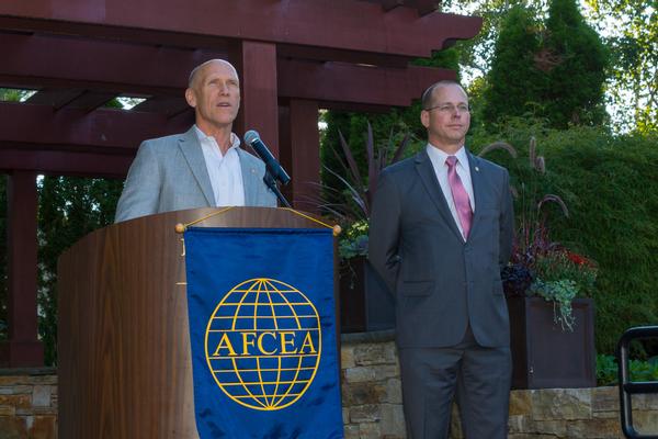 Bud Vazquez (l), outgoing AFCEA regional vice president, thanks  David Hiltz, outgoing chapter president, in August on his record of outstanding achievement during the past year as Hiltz turns chapter leadership over to incoming president Pat Dagle.     