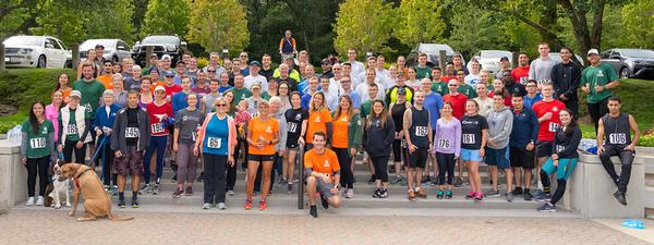 Participants join in a group photo at conclusion of the annual Young AFCEAN (YAC) 5K Family Fun Run for STEM in September.