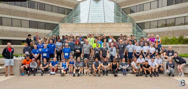 Runners join in a group photo at the Young AFCEAN Emerging Leaders annual 5K Race for STEM held in September.  