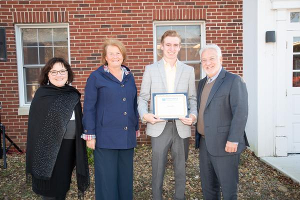 At the October event, (l-r) Arlene Rodriguez, interim provost and vice president, Academic Student Affairs, Middlesex Community College (MCC), and Jeannine Robbins-Murphy, daughter of Tom O'Mahony, join Philip Sisson, president, MCC (far r), in congratulating Tyler Galvin (second r), this year's recipient of the AFCEA Thomas O'Mahony 