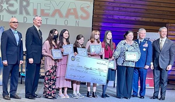 In February, the chapter presents big-check awards to winners of Best All-Female Middle School, Krueger Middle School, School of Applied Technologies - Team Cryptic.