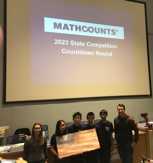 At the March MATHCOUNTS event, Alex Swope (far l) and Will Keller (far r) pose for a photo with the top four winners (l-r) Selena Ge, Adam Ge, Christopher Cheng and Nikhil Byrapuram.