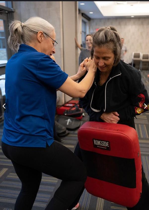 In March, Pam Winters (l) practices self-defense moves with instructor, Jennifer Jordan.