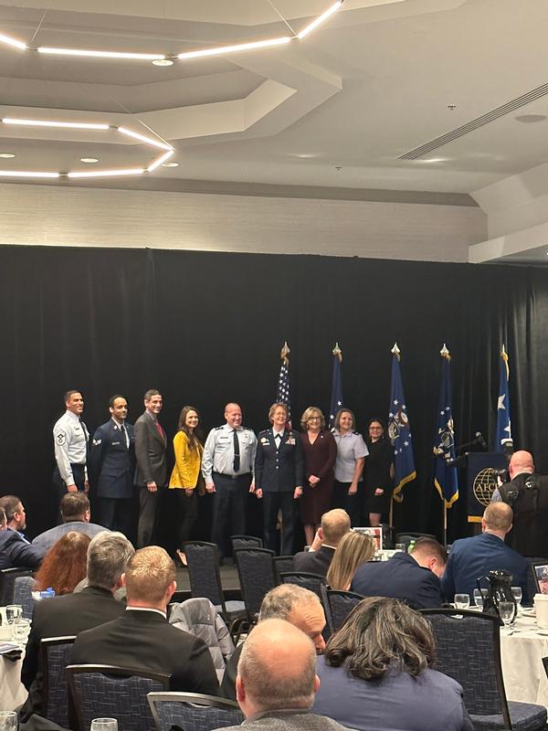 Maj. Gen. Genatempo of Command, Control, Communications and Networks Directorate (center l), and Hanscom Air Force Base leaders join Lt. Gen. Donna Shipton, commander, Air Force Life Cycle Management Center (center r), on stage at the February event.