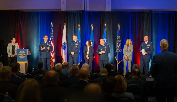 In March, Deb Zides, New Horizons chair (l), moderates a Q&A session with Maj. Gen. Anthony Genatempo, USAF (c), and his portfolio leads.