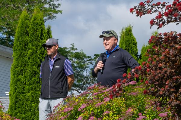 In June, Maj. Gen. Anthony Genatempo, USAF, addresses the golfers before the round with tournament chair, Ned Clay.