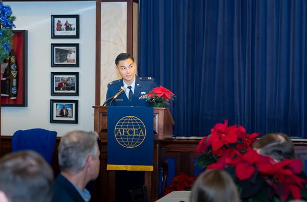 Capt. Hansel Suharli, USAF, serves as emcee for the December event.