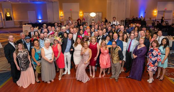 Spring gala participants join in a fun group photo during the May event. 