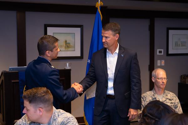 Lt. Col. Jesse Jaramillo, USAF, commander, Air Force ROTC, chapter 2nd vice president and master of ceremonies (l), thanks Marion at conclusion of his informative address about Air Force cyber initiatives at the chapter's July speaker series breakfast. 