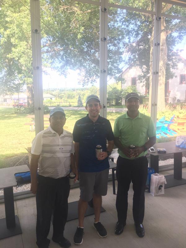 At this year's Annual Diversity Golf event held in August, participants (l-r) Akash Kabir, Alex Michapoulos and Khairul Kabir pose for a photo celebrating their second place finish. 