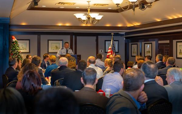 Col. King speaks to a packed audience at the December breakfast meeting and fields questions about the future of IT in the Air Force.
