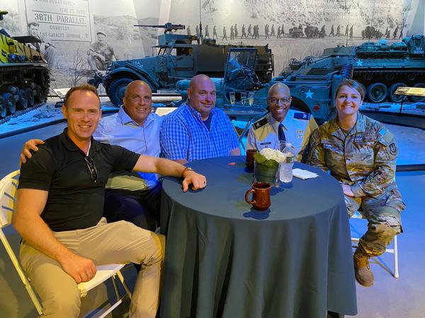 (l-r) Ben Peterson, Mark Merlino, Mathew Correa, Col. James Vandross, USAF, and Col. Taona Enriquez, USAF,  pose for a photo at the annual chapter social in August.