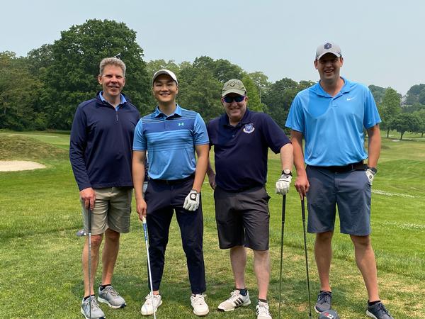 Golf event participants (l-r) Glen Townsend; Lt. Hansel Suharli, USAF; Maj. Gen. Anthony Genatempo, USAF; and Pat Hamilton, chapter president, pause for the cameras during the June fundraising event.