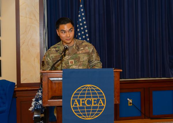 Capt. Hansel Suharli, USAF, emcees the December award ceremony at the Minuteman Commons, Hanscom Air Base, Massachusetts.