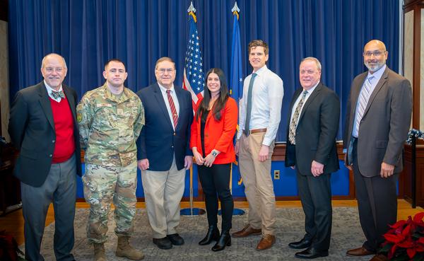 The Unsung Hero Award winners pose for a photo at the December event.