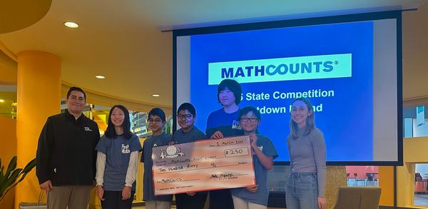 The winners of the 2025 competition pose for a photo at the March event.