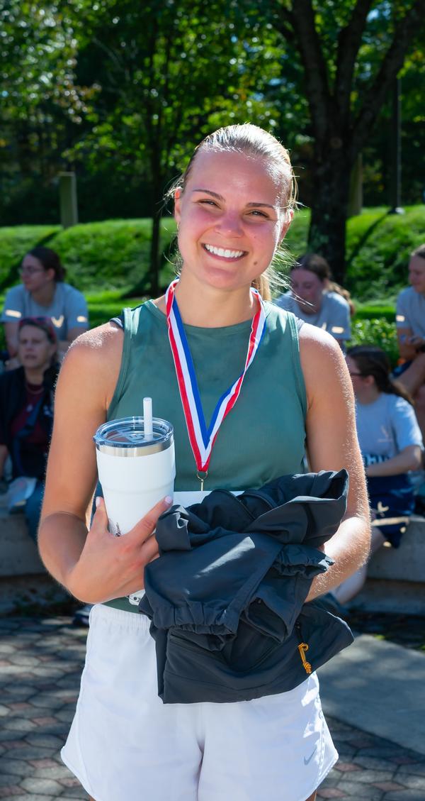 In September, women's winner Becca Gagnon smiles for the camera after the STEM 5K Fun Run.