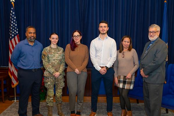 2025 Unsung Hero Award Recipients pose for a photo at the December event.