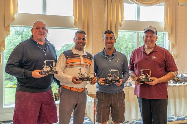 Nabbing first place in the first flight at the chapter's September golf fundraiser are (l-r) Steve Ramos, Mark Webb, Shawn Perrine and Matt Andrate. 