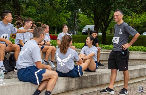Mark Maybury, former chief scientist of the Air Force (AF), now with Stanley Black & Decker (far r), enjoys a chat with a group of Worcester Polytechnic Institute AF ROTC cadets prior to the start of this year's in-person 5K Run for STEM.   