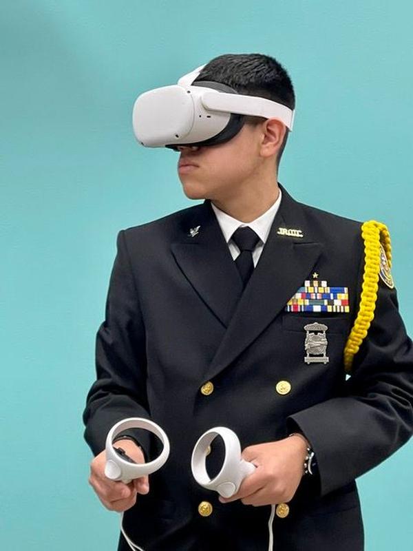 A student tests out some of the artificial intelligence equipment during the career fair portion of the San Antonio Mayor's Cyber Cup in February. 