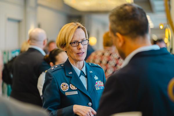 Maj. Gen. Heather Pringle, USAF, commander, Air Force Research Laboratory, talks to a fellow attendee at the New Horizons 2023 event in March.