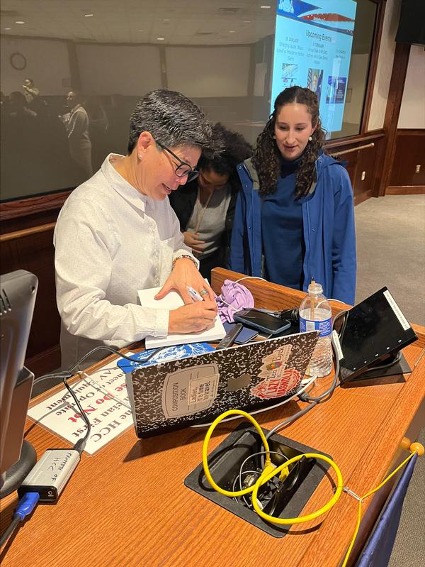 In January, participants are rewarded with signed books at the end of the Col. Barrett's presentation.