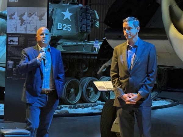 Brig. Gen. Mark Merlino, USA (Ret.), Raytheon (l), and Mike McGinley speak to attendees at the September event.