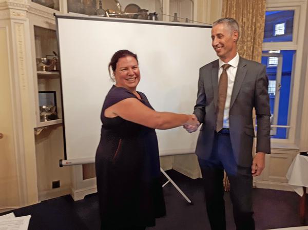 Air Commodore Nick Lloyd (Ret.), deputy chief information security officer and head of cyber security plans and engagement, Maersk, formally hands over to Jacqui Chard as the new chapter president.