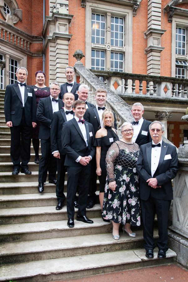 Most of the current chapter committee poses for a photo at the Annual Cyber Dinner in June. 