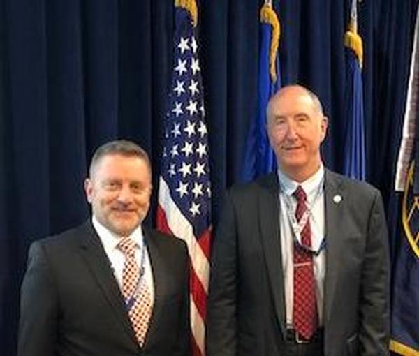 Col. Scott Beidleman, USAF (Ret.), chapter president (l), poses with Steve Pluntze, executive director and civilian deputy director, Remote Sensing Directorate, Space and Missile Systems Center, Los Angeles, at the July meeting.
