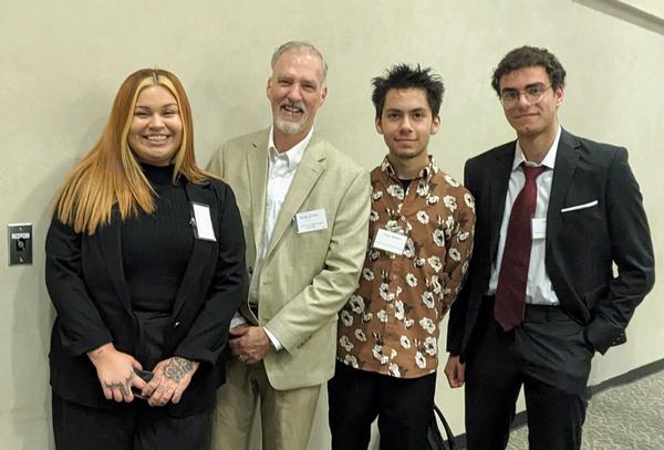 Bernard "Bernie Gruber (second from l) awards the chapter scholarships for STEM in July.   