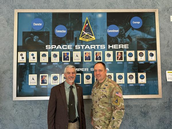 Todd Wiest, chapter president, poses with Col. Brendan Hochstein, USSF, System Delta 89, at the May chapter event.