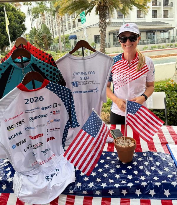 Callie manages registration and jersey distribution for the July event.