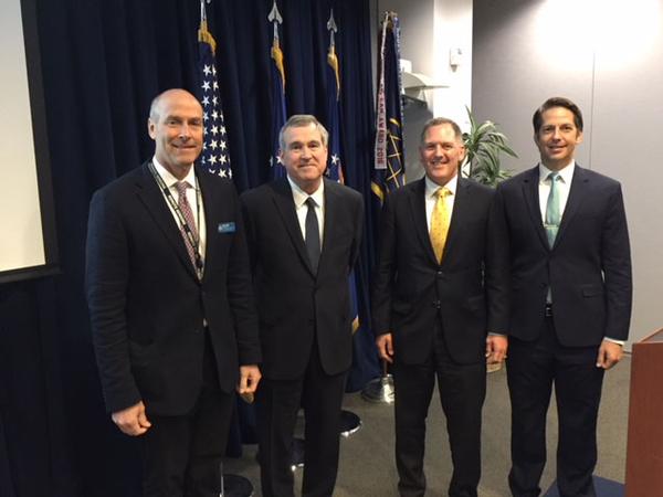 April guest speaker Tom Fitzgerald, director of engineering at the Air Force Space Command's Space and Missile Systems Center, Los Angeles Air Force Base (c), pauses for a photo with chapter officers (from l) Bill Page, president, Lane Gilchrist, vice president, finance, and Michael Plantenga, secretary. 