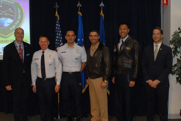 Chapter President Bill Page (far l) and Secretary Mike Plantenga (far r) stop for a photo with participants in the warfighters panel on the second day of May's GPS Partnership Council.