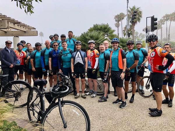 In July, participants in the Cycling for STEM event prepare to register on the beach.