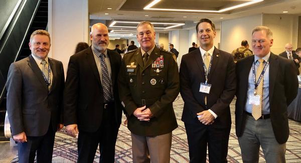 In October, Gen. Dickinson (c) pauses for a photo with members of the chapter to include (l-r) Col. Scott Beidleman, USAF (Ret.), Adam Feingold, regional vice president, Mike Plantenga, chapter president, and Lane Gilchrist, chapter treasurer.
