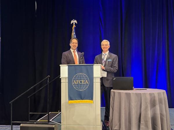 Mike Plantenga, chapter president (l), and Todd Wiest, chapter vice president of programs and master of ceremonies, open the first day of presentations at the October event.