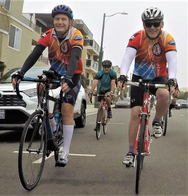 Col. Sean Rucker, USAF (Ret.), and Col. Jeff Stutz, USAF (Ret.), ride in the Cycling for STEM event in Los Angeles in July.