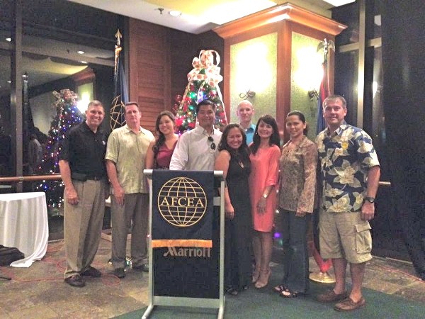 Col. Mike Warlick, USMC (Ret.), vice president for regional and chapter outreach/deputy for defense, AFCEA International, visits with the chapter's officers in December.