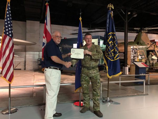 Gillis presents a Certificate of Appreciation and Chapter Coin to Air Commodore Thompson.