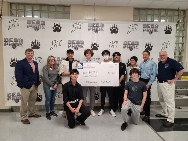 Students and their adviser accept a grant from chapter officers.<br />(standing l-r) Blake Lee, chapter vice president for Emerging Leaders; Trish Peters, club adviser; Om Patel; Padraig Littlefield; Christian Nguyen; Vincent Le; Emily Nguyen; Alan Frost, chapter treasurer; and Dan Gillis, chapter executive vice president.<br />(kneeling l-r) Jason Lai and Peyton Parrish.