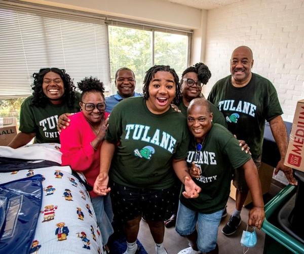 Surrounded by family, Vakaya Lee (c) moves into a dorm at Tulane University in August. Lee was the recipient of a $1,000 scholarship. Go GreenWaves!!