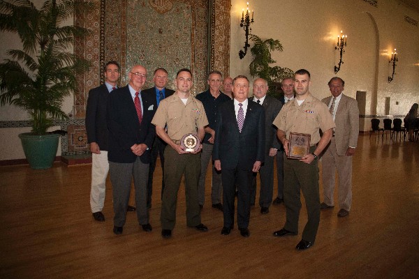 Together in the first row (l-r) the Electrical & Computer Engineering and 25th annual Joint C4I AFCEA John McReynolds Wozencraft awards presentations in June are Larry Reeves, chapter president; Joint C4I awardee Capt. Kevin McMullen, USMC; Vice Adm. Ronald Route, USN (Ret.), president, Naval Postgraduate School (NPS); and Electrical & Computer Engineering awardee Capt. Douglas Columbus, USMC. In the second row are Paul Cutt of the chapter; Dr. John Arquilla, chairman, Defense Analysis, NPS; Dr. Dennis Volpano, professor, computer sciences, NPS; Cmdr. Thor Martinsen, USN, program officer, electrical and computer engineering and applied mathematics, NPS; Dr. Douglas Hensler, provost, NPS; Dr. Phil Durkee, dean, Graduate School of Engineering and Applied Sciences, NPS; and Dr. Sherif Michael, professor, electrical engineering, NPS.  The new AFCEA clock award was admired by the 30 other awardees and many attendees at the Spring Quarter ceremony. 
Photo by Javier Chagoya, Offical Navy Photographer