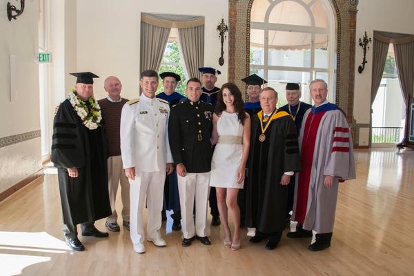 Joining the Naval Postgraduate School (NPS) commencement speaker for the summer quarter, Adm. Bill Moran, USN, vice chief of naval operations (3rd from l), are (l-r) Cmdr. Thor Martinsen, Ph.D.; Chapter President Lawrence Reeves; John McEachen, NPS professor; Capt. Julian D'Orsaneo, USMC; Douglas Fouts, NPS professor; Rachel D'Orsaneo; Robert Ashton, NPS professor; Vice Adm. Ronald Route, USN (Ret.), NPS president; Herschel Loomis, NPS professor; and NPS Provost Steven Lerman. Adm. Moran spoke at September ceremony.